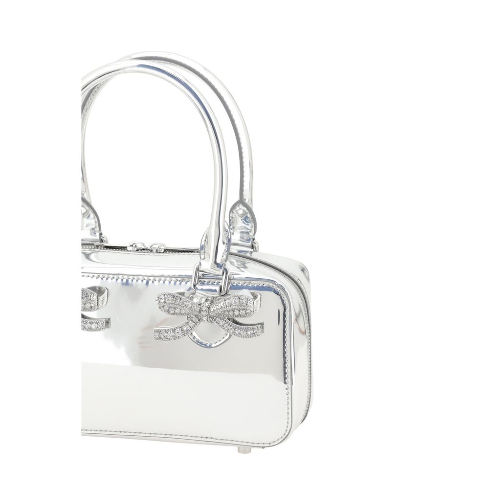 Luxurious leather handbag with two tubular handles and metallic feet