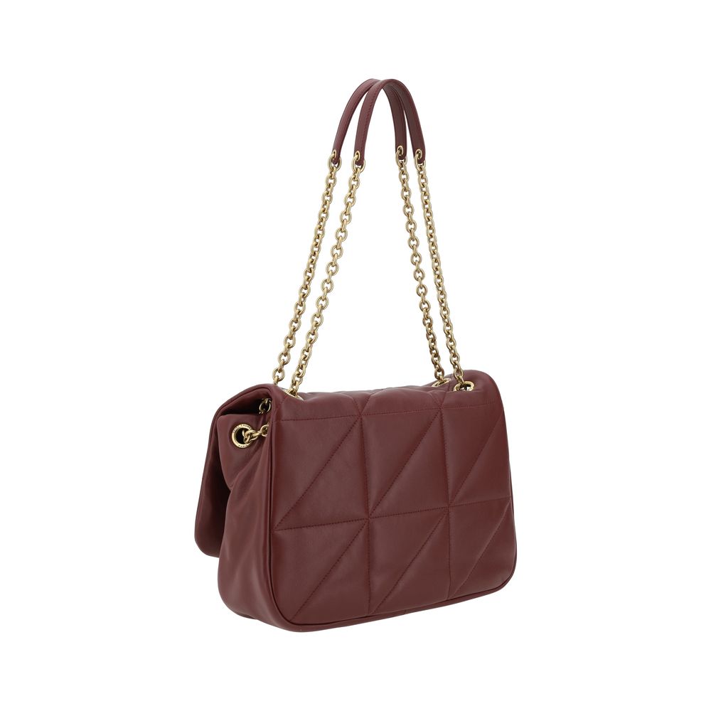 Three-dimensional, gold-plated, appliquéd YSL logo on the front of the Jamie Medium Shoulder Bag
