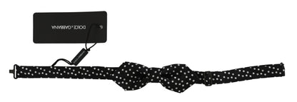Dolce & Gabbana black silk bow tie with classic polka dot design, adjustable length neck strap, made in Italy