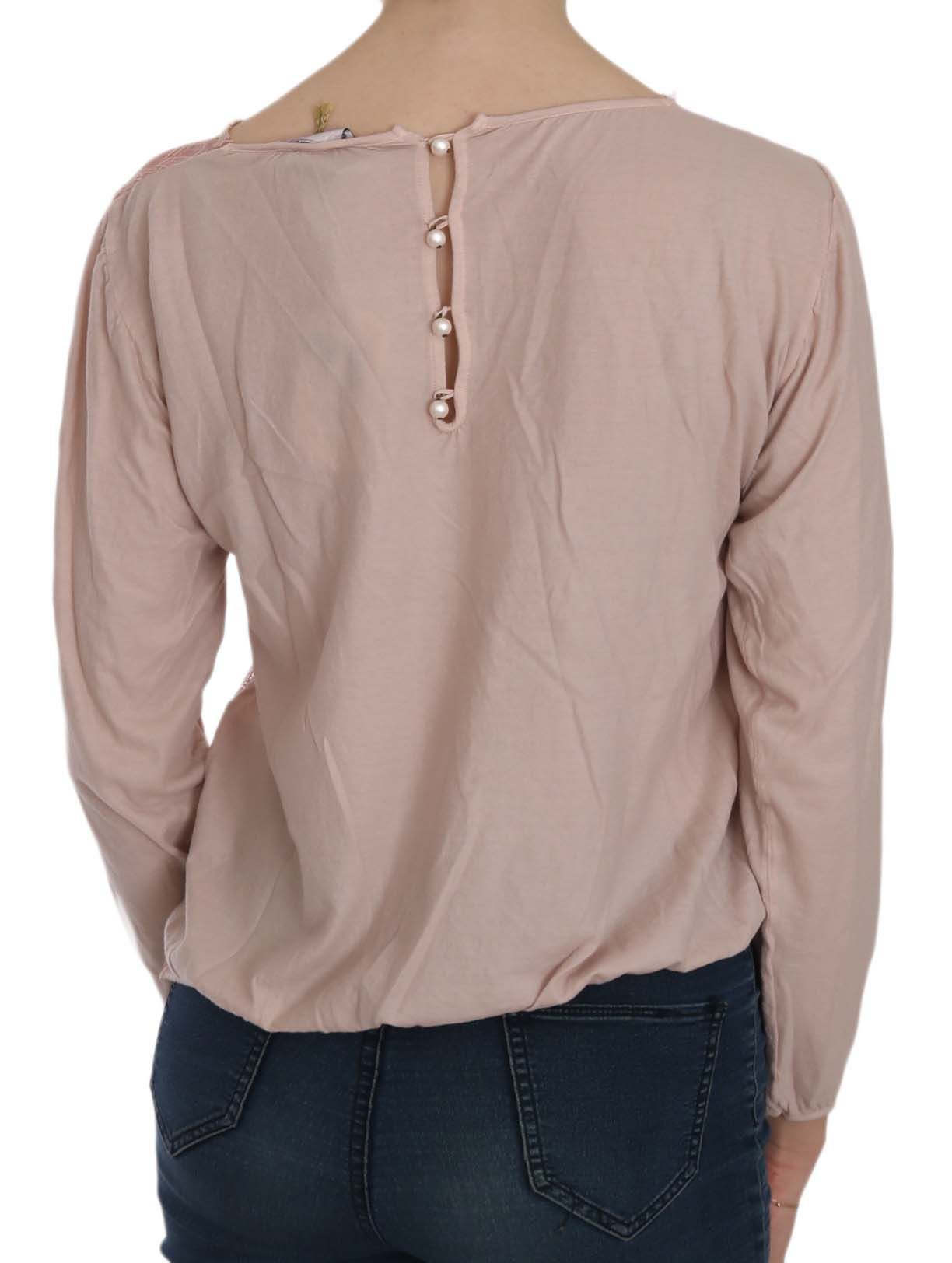 Stunning pink blouse adorned with elegant button closure and subtle logo details