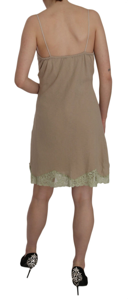 Beige lace mini dress with intricate lacework and chic spaghetti strap design