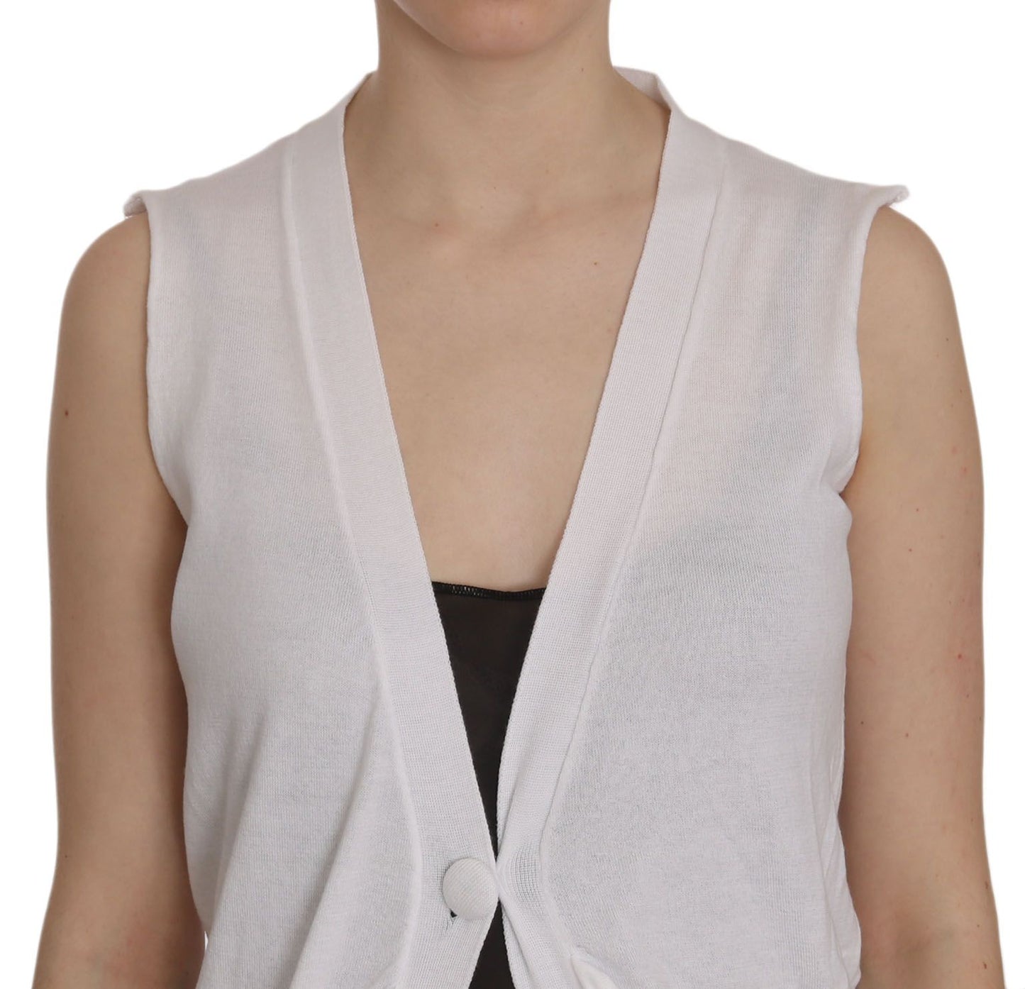 Woman wearing the sleeveless cardigan top vest, showcasing the two front pockets