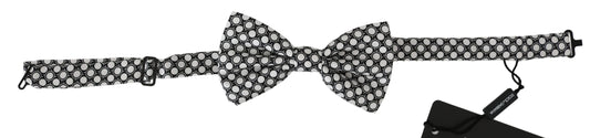 Exude timeless elegance with this stunning 100% Authentic Dolce & Gabbana bow tie, brand new with tags crafted from luxurious silk, featuring a black and white circular pattern Guaranteed to elevate your formal attire, the adjustable neck strap ensures a perfect fit for any occasion 