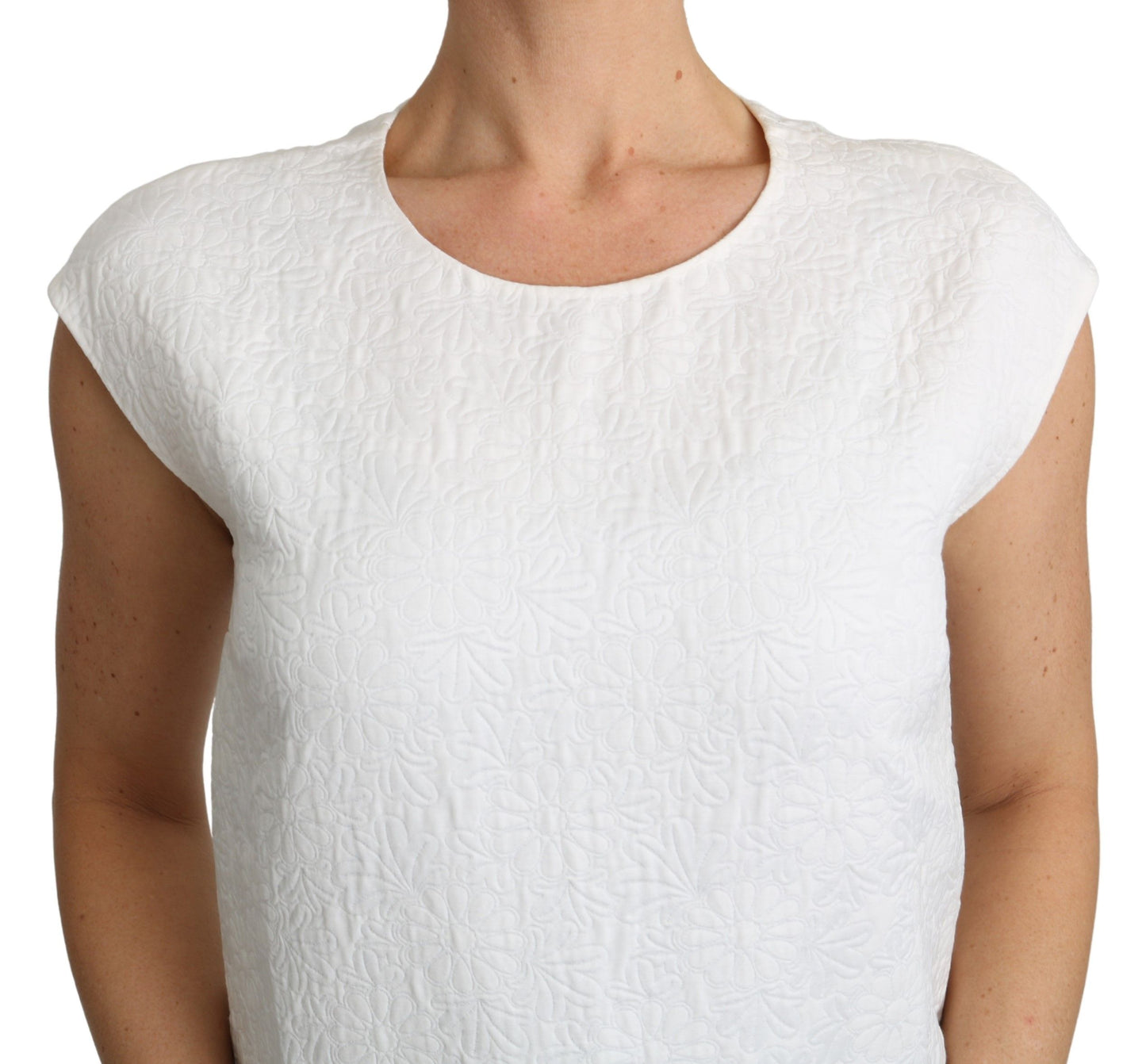 Gorgeous white top adorned with brand’s signature details