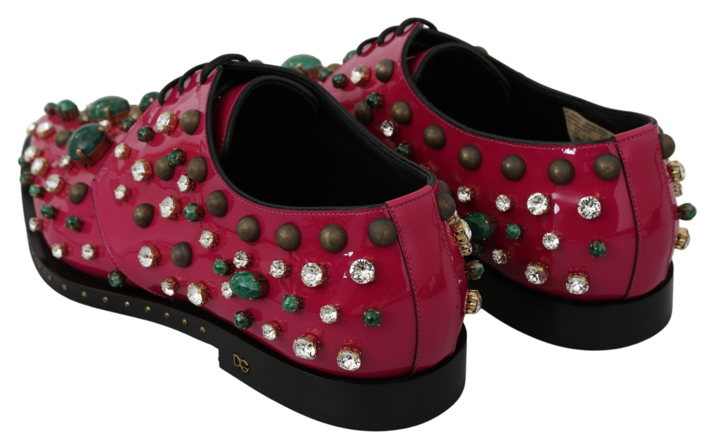 Fine Italian craftsmanship showcased in these fuchsia pink crystal patent flats by Dolce & Gabbana