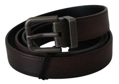 Authentic Dolce & Gabbana belt made from the finest leather in a rich brown hue, with a subtle gray buckle and iconic logo detail