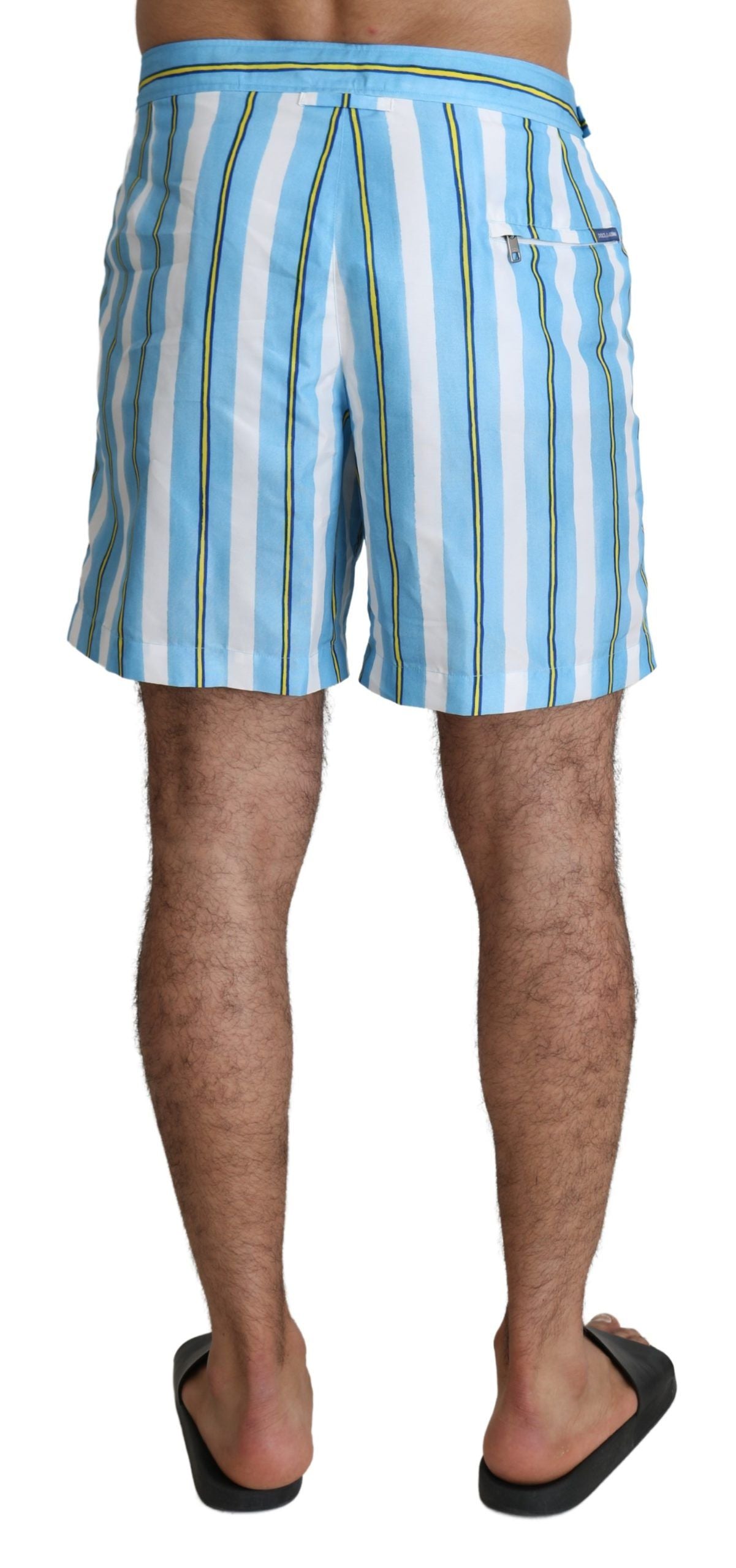 Iconic Italian swimwear featuring distinct logo details and front/back pockets