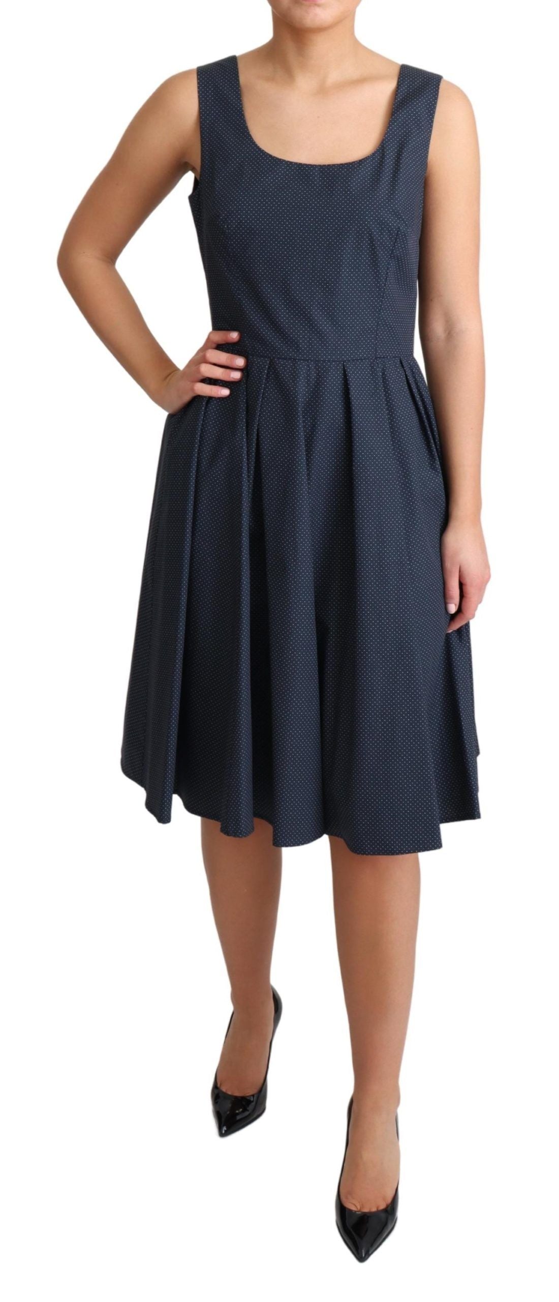 Sleeveless A-line dress in classic blue with charming white polka dots