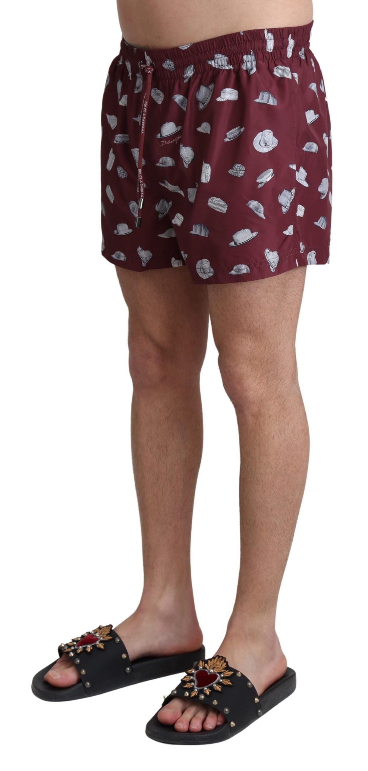 Luxurious Maroon Elegance Men's Swimming Trunks featuring a secure zip rear pocket and playful hats print