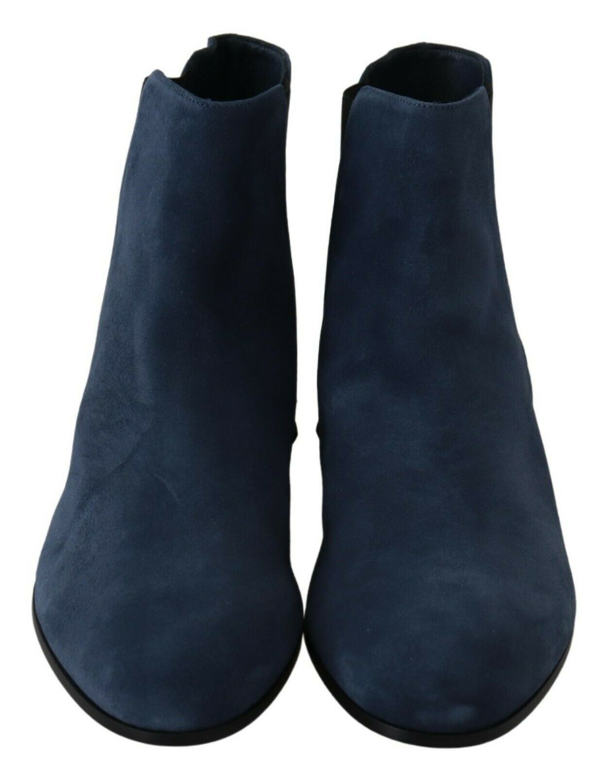 Luxury mid-calf boots with tags, attention to detail, and sophistication