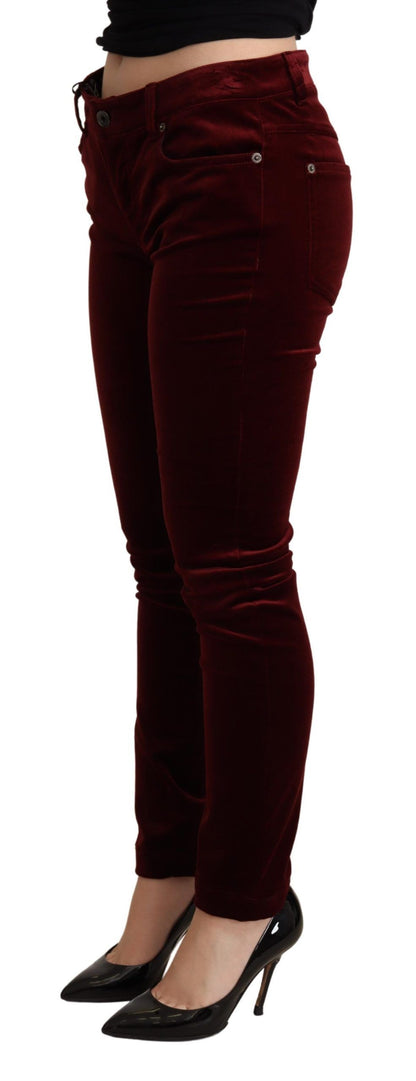 Rich bordeaux red skinny pants with mid-waist fit and zipper closure