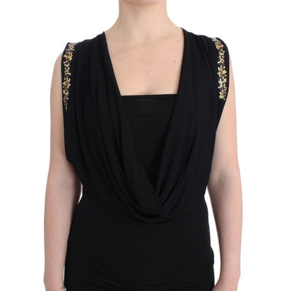  Sleeveless black dress with gold metal details and draped neckline 