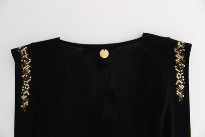  Sleeveless black mini dress with opulent gold metal details 