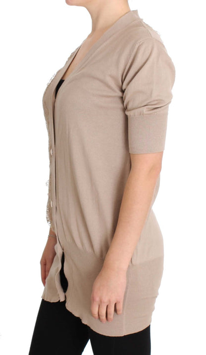 Delicate cotton lace adorn this elegant pink cardigan sweater from PINK MEMORIES