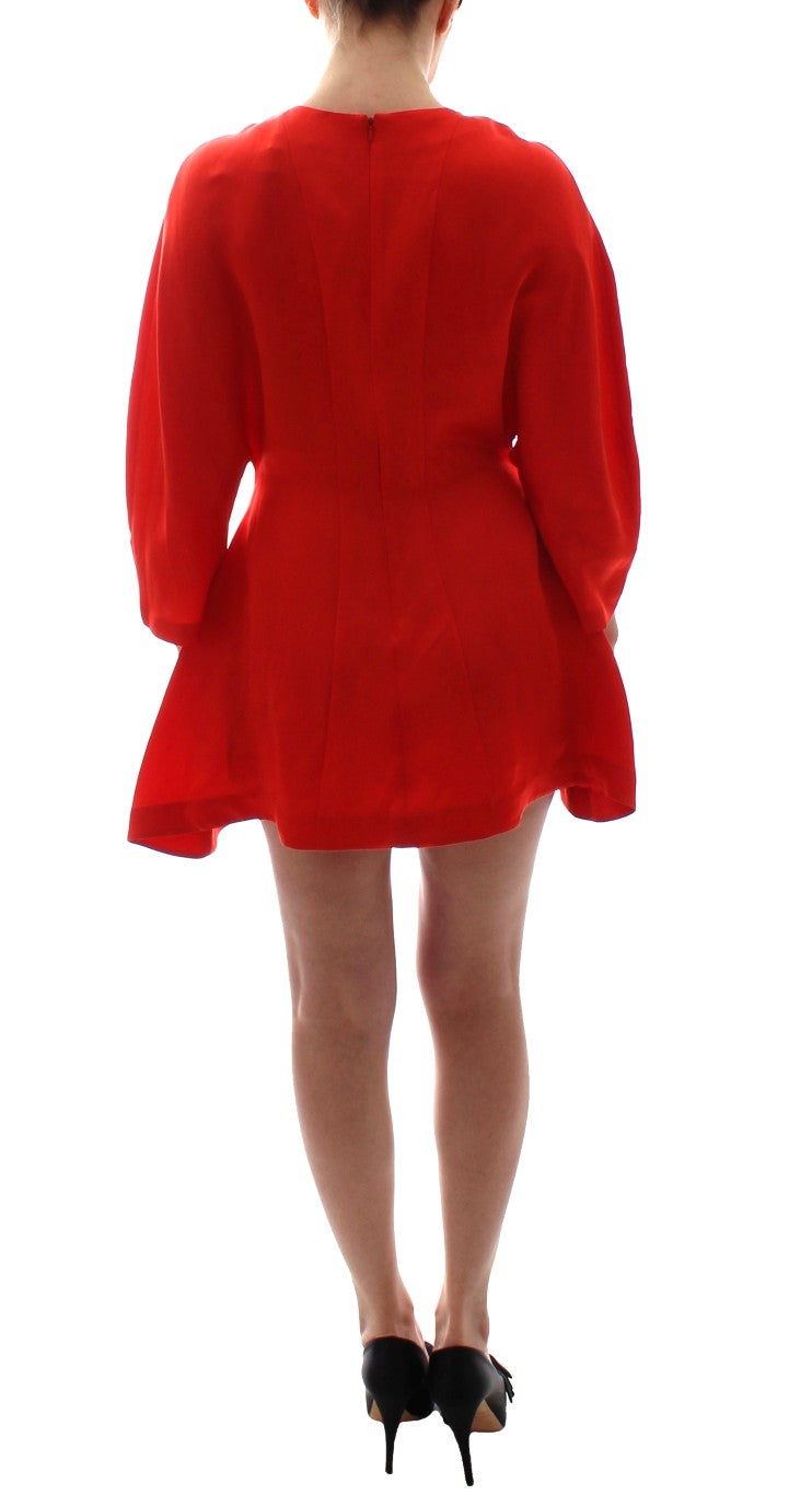 Vibrant red artisan dress showcasing expert craftsmanship and high fashion