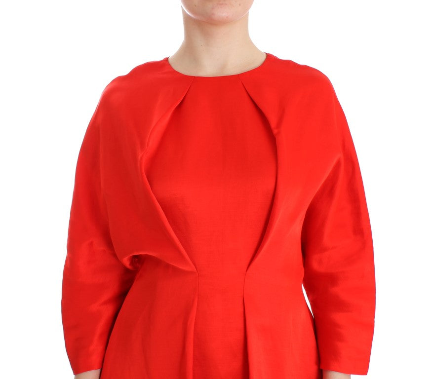 Exclusive red dress reflecting the designer’s dedication to quality and style