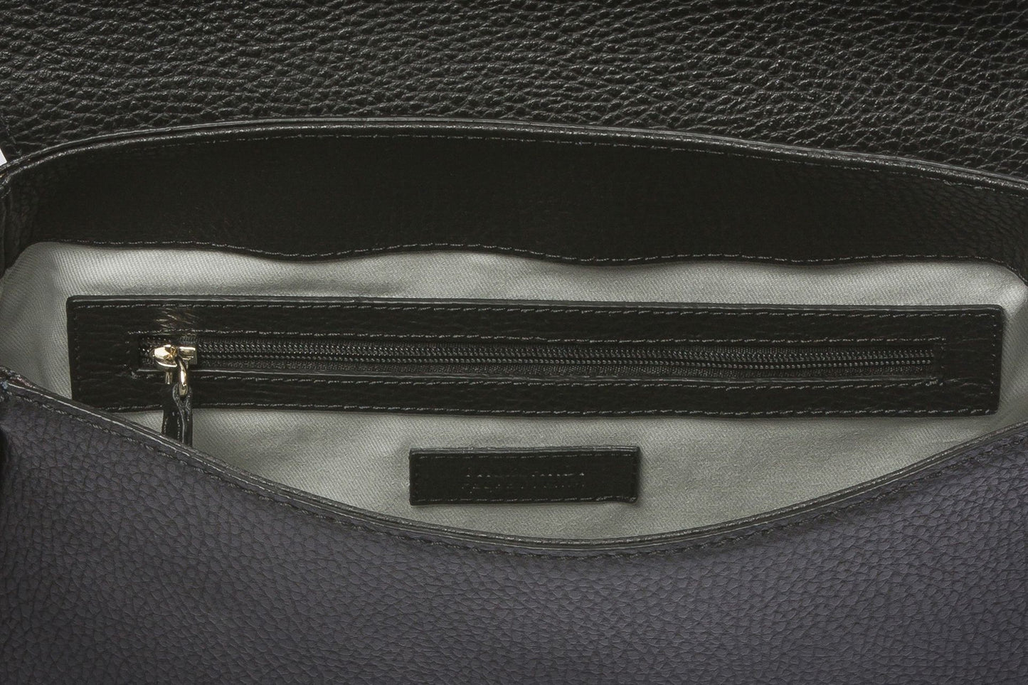 Luxurious brown leather handbag blending timeless design with contemporary edge