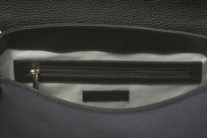 Luxurious brown leather handbag blending timeless design with contemporary edge
