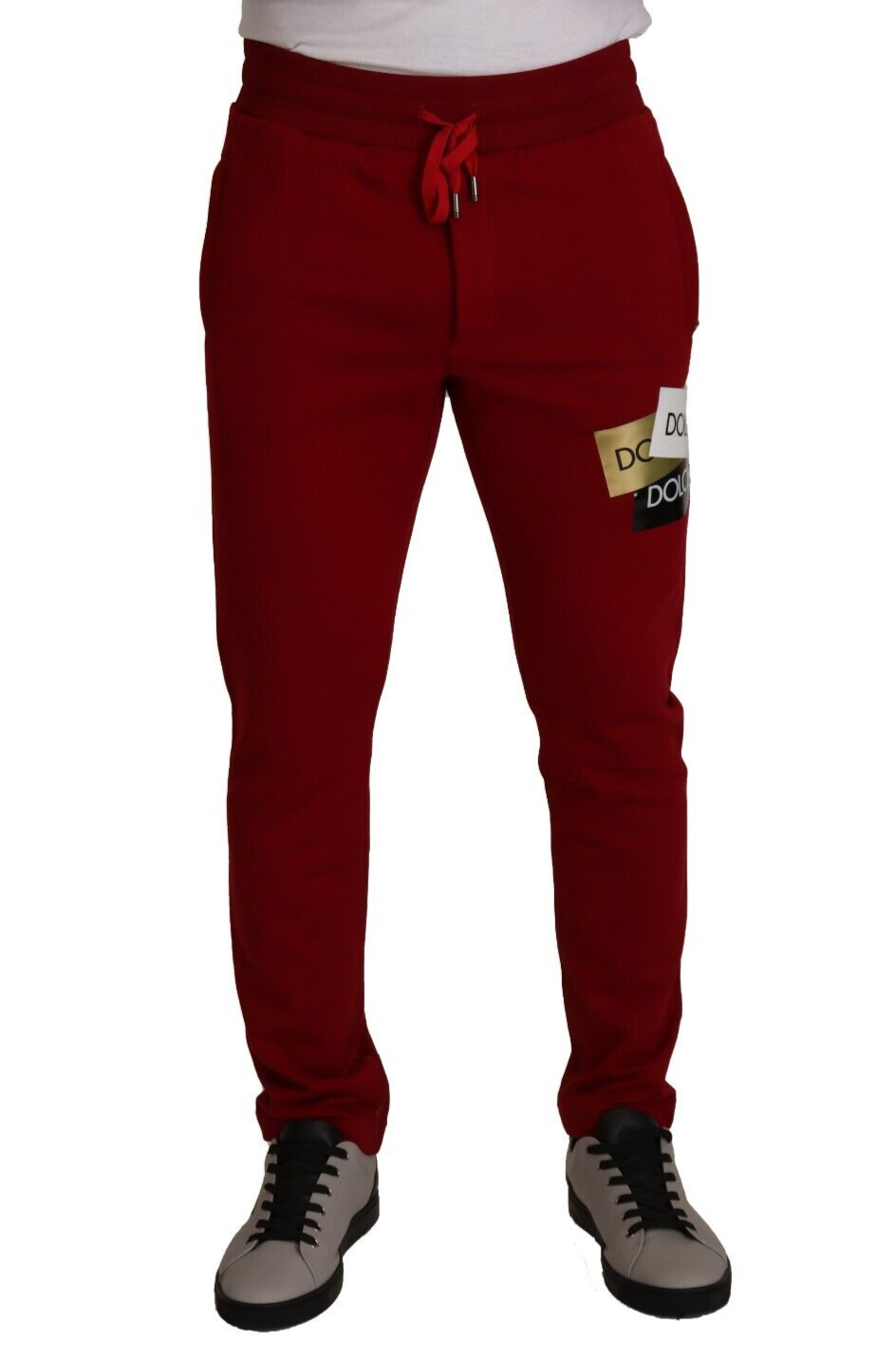 Stunning red jogging pants with drawstring closure and logo patch from Dolce & Gabbana