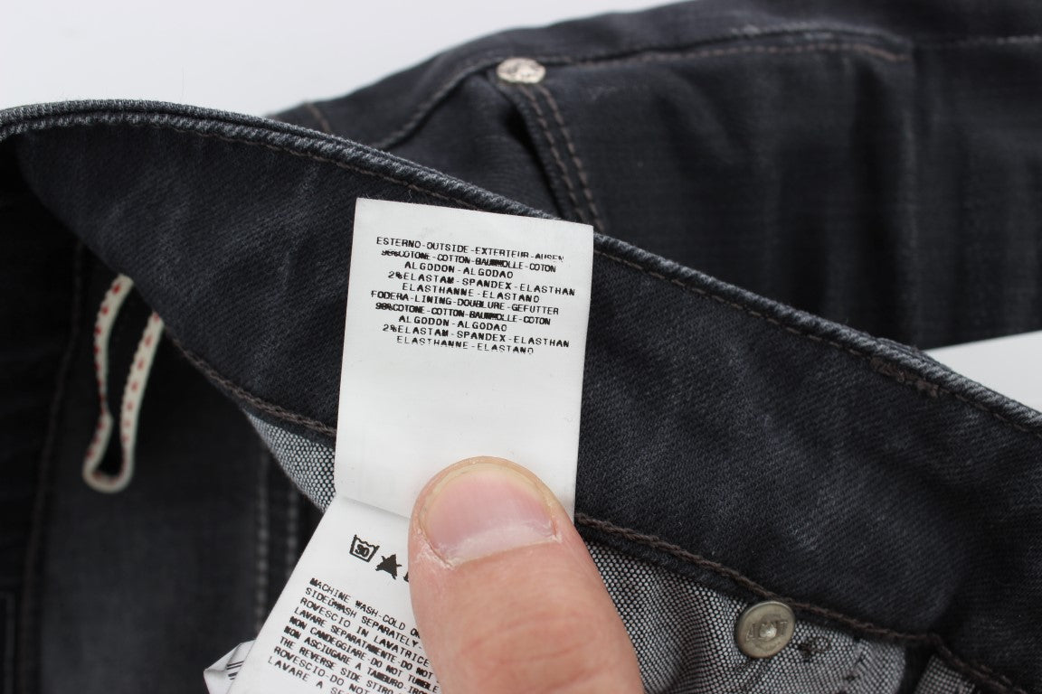 Detailed view of slim-fit men's jeans in classic gray color