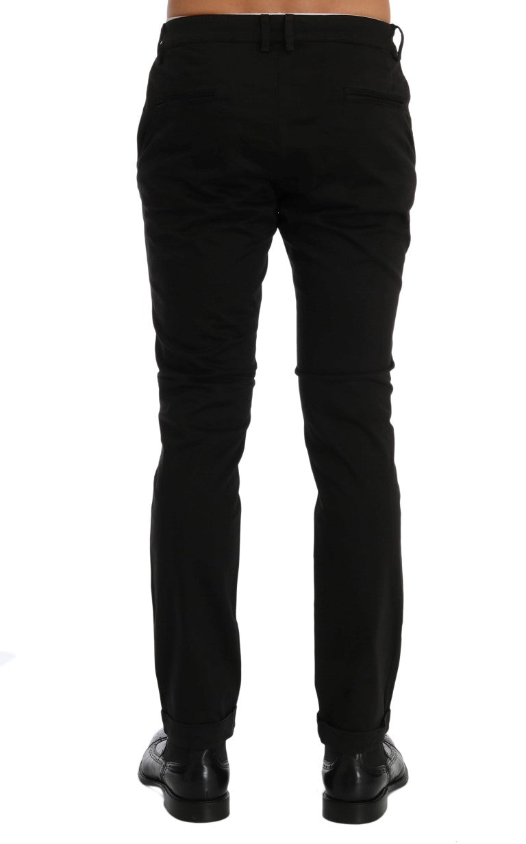 Back view of slim fit black pants with back pockets