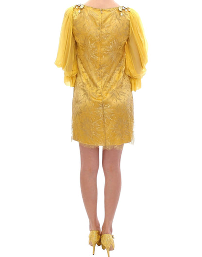 Elegant Dolce & Gabbana Yellow Lace Crystal Embellished Mini Dress featuring knee-high length for a contemporary charm