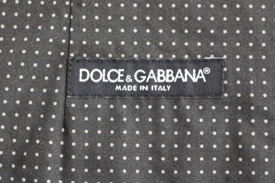 Full front button closure and subtle gray dotted pattern on Dolce & Gabbana Elegant Gray Cotton Dress Vest