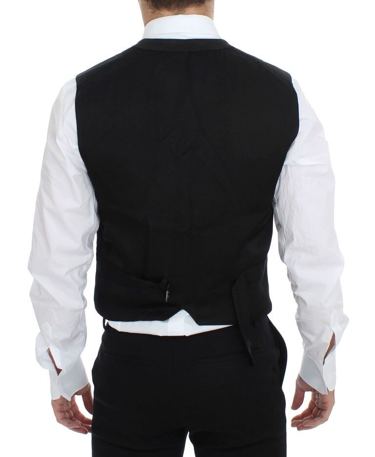 Detailed close-up of the signature logo on the black vest