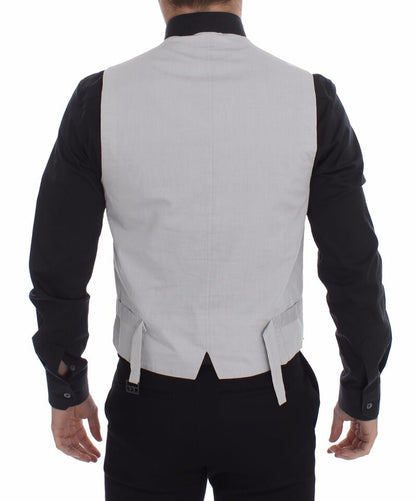 Sophisticated single-breasted design with a full front button closure and an adjustable back waist strap for a tailored fit