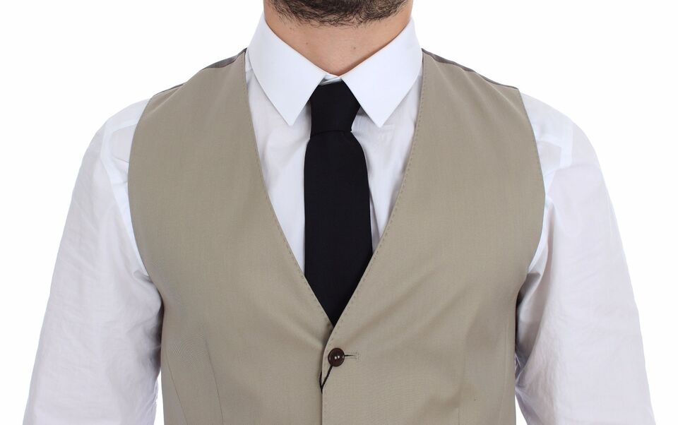 Dolce & Gabbana Elegant Beige Cotton Dress Vest back view showing the sleek design and logo details