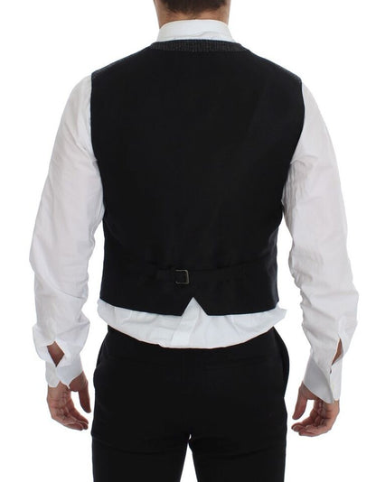Gray vest made with 50% Wool, 15% Cotton, 11% Lana Wool, 11% Acrylic, 8% Polyester, 5% Others