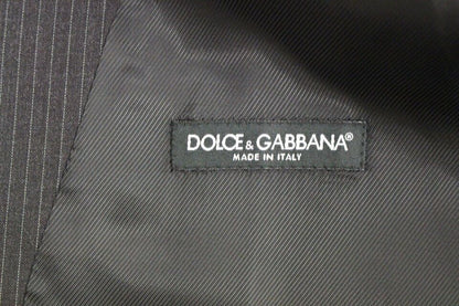 Dolce & Gabbana Elegant Gray Striped Dress Vest made of 100% wool and featuring a single-breasted design with adjustable back waist strap for a tailored fit and a polished button closure, perfect for layering over professional or formal attire
