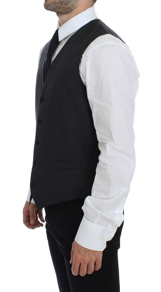 Dolce & Gabbana dress vest in a refined gray color with a single-breasted design and adjustable back waist strap for a tailored fit, perfect for layering over professional or formal attire
