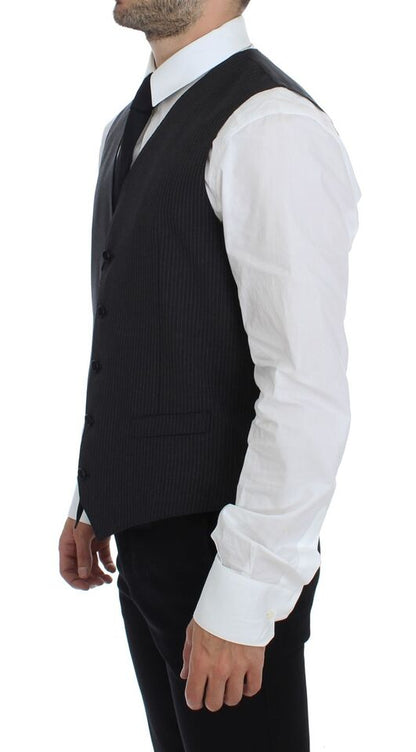 Dolce & Gabbana dress vest in a refined gray color with a single-breasted design and adjustable back waist strap for a tailored fit, perfect for layering over professional or formal attire