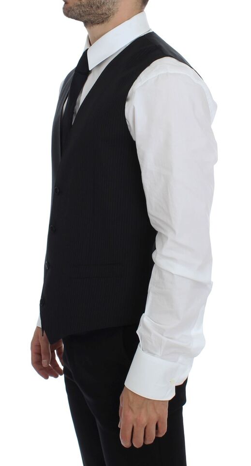 Elevates any formal ensemble with its full front button closure and adjustable back waist strap