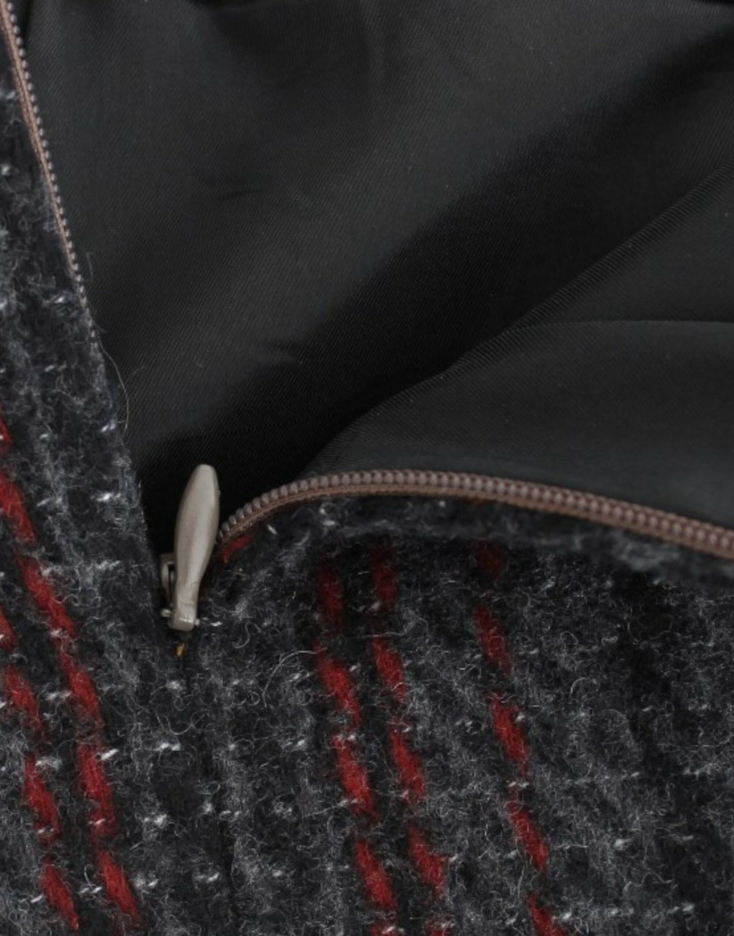 Made in Italy with side zip closure and store bag included