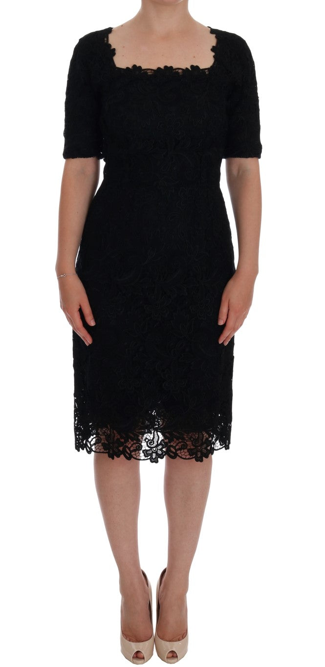 Elegant black knee-length sheath dress with short sleeves and full zipper