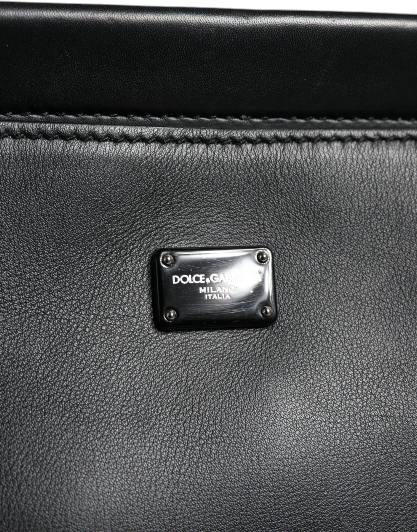 Dolce & Gabbana black leather bag with padded top handle and magnetic closure