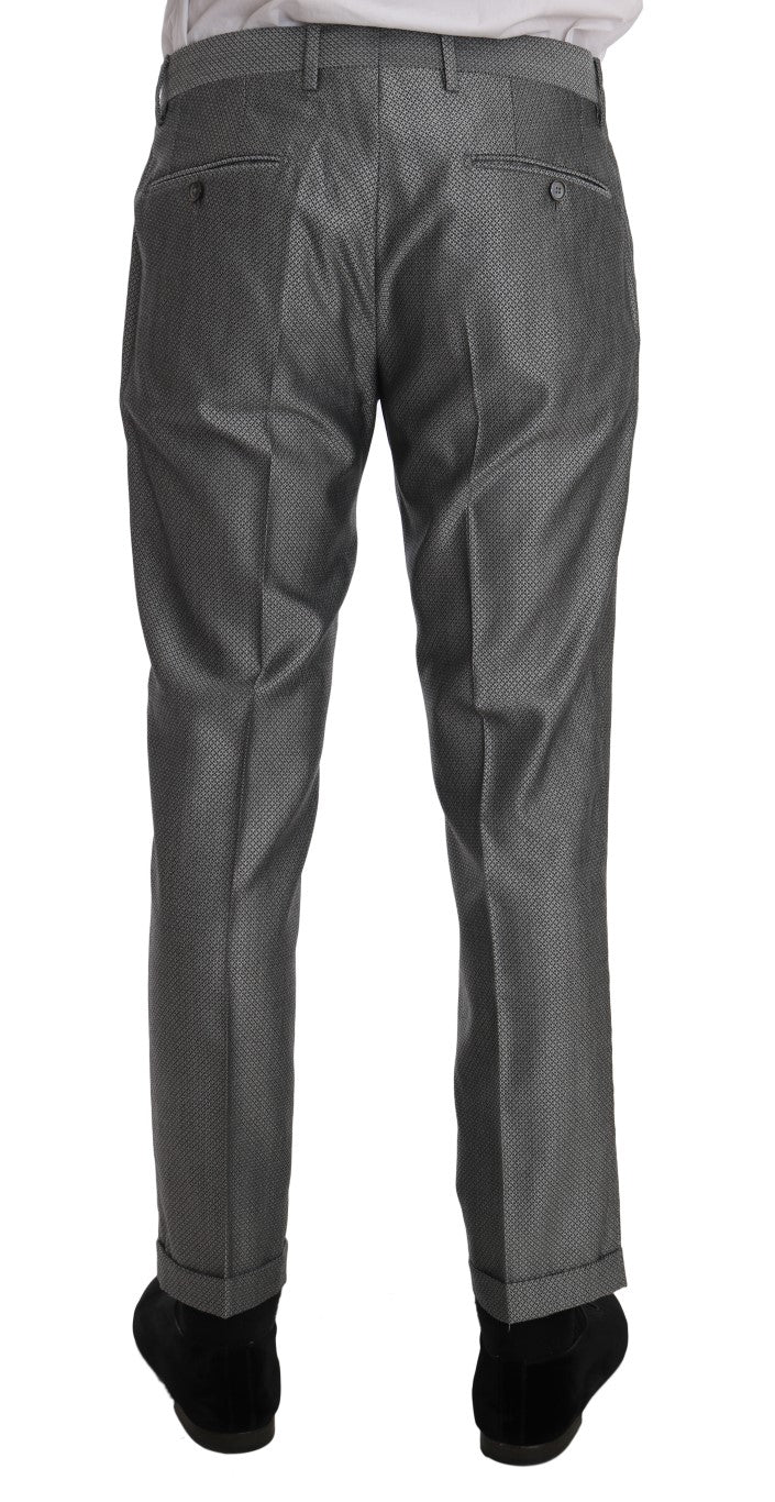 Iconic black double-breasted suit from Dolce & Gabbana, featuring a crystal bee embroidery and two-button closure blazer