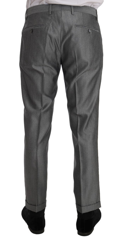 Iconic black double-breasted suit from Dolce & Gabbana, featuring a crystal bee embroidery and two-button closure blazer