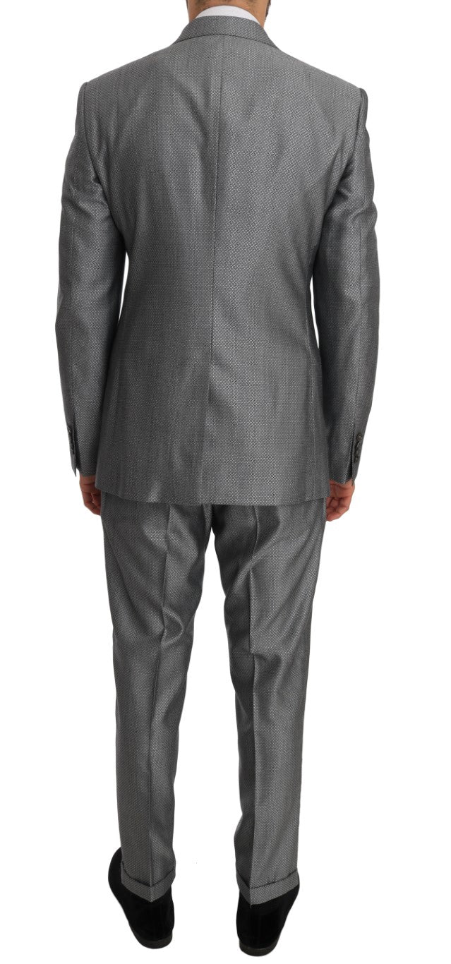Elegant black double-breasted suit from Dolce & Gabbana, meticulously embroidered with a crystal bee for a touch of opulence