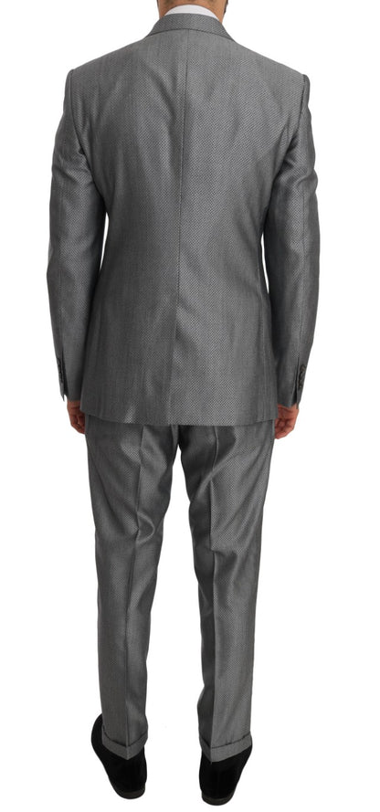 Elegant black double-breasted suit from Dolce & Gabbana, meticulously embroidered with a crystal bee for a touch of opulence