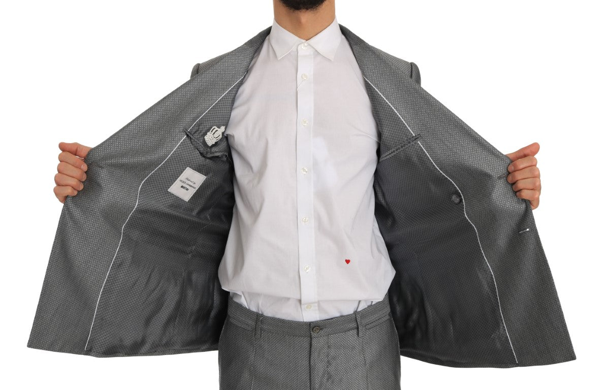 Sharp tailoring and slim fit make this Italian-made black double-breasted suit a standout choice for formal events