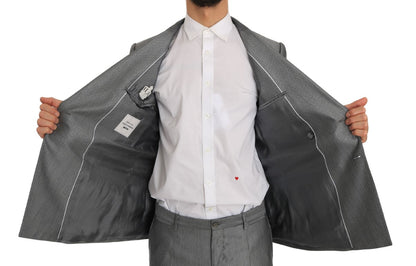 Sharp tailoring and slim fit make this Italian-made black double-breasted suit a standout choice for formal events