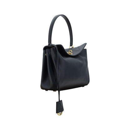 Elegant and versatile leather bag with swivel closure front flap