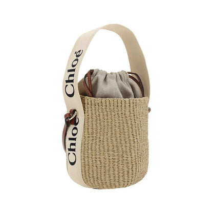 Interior pouch with drawstring closure and cotton handle with brand logo