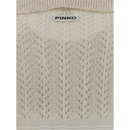 Versatile and comfortable light pink sweater with airy texture and structured fit