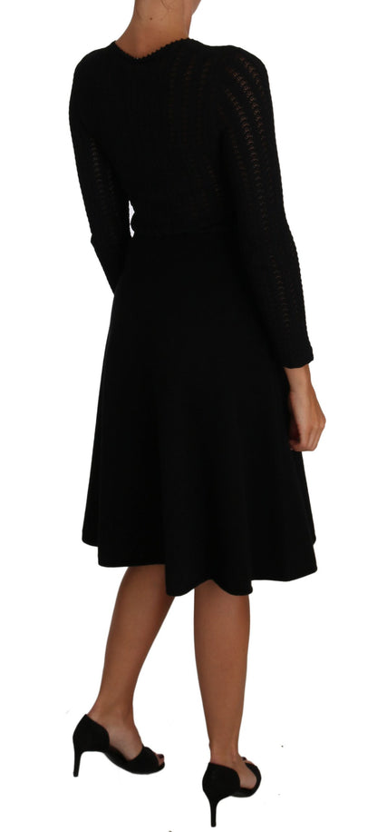 Long sleeve, black dress perfect for sophisticated events