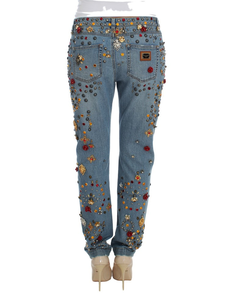Luxurious light blue wash Dolce & Gabbana boyfriend jeans with meticulous gold and silver metal detailing