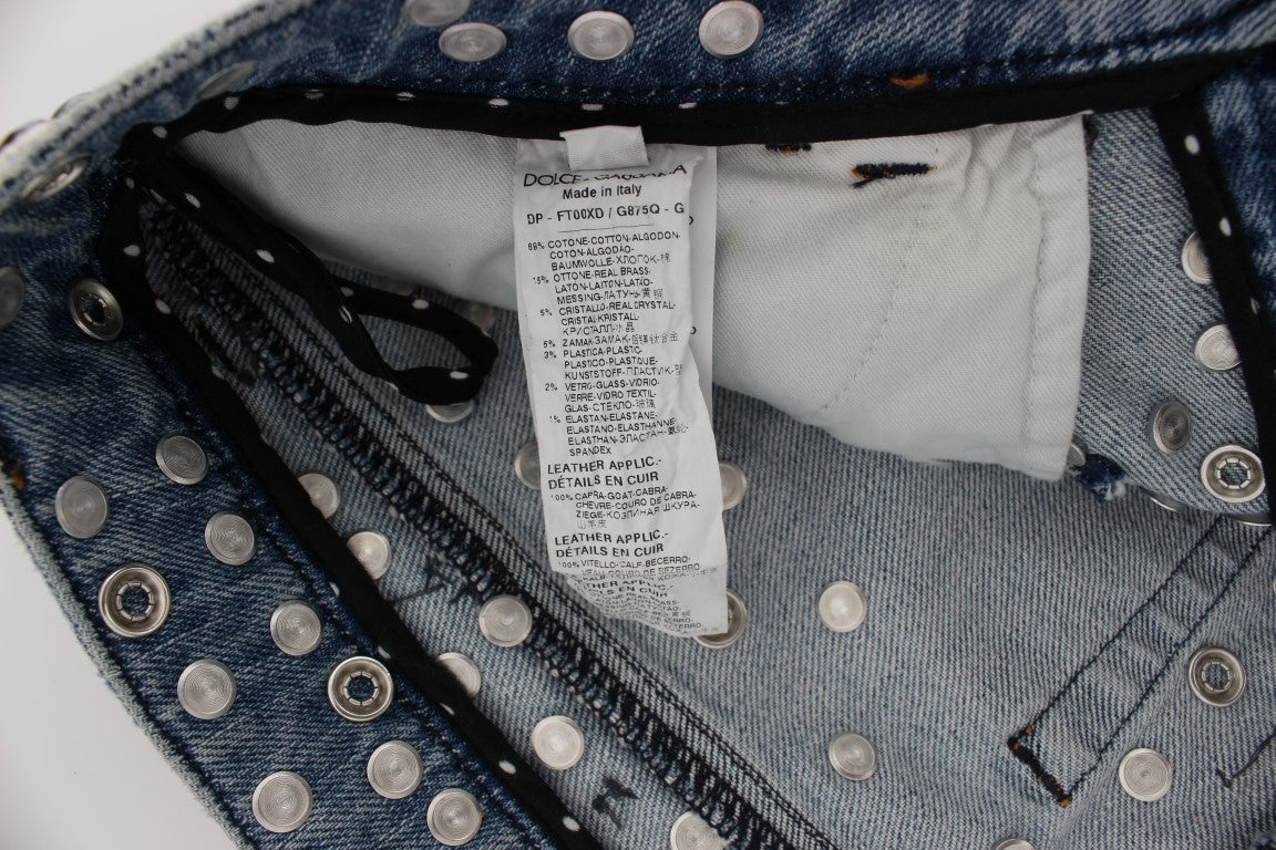 Italian-made Dolce & Gabbana boyfriend fit jeans with a light blue wash and enchanting crystal heart and rose embellishments
